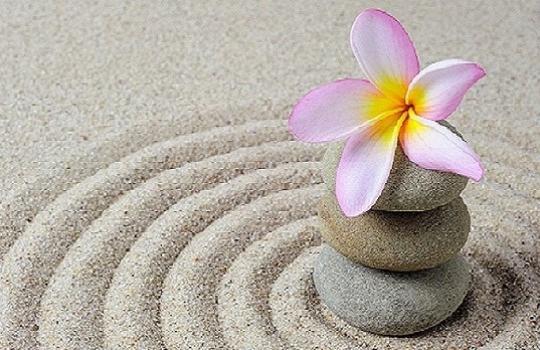 Zen flower on rippling sand